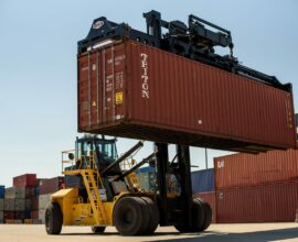 Taylor 900 series reach stacker at the port, running Axletech axles