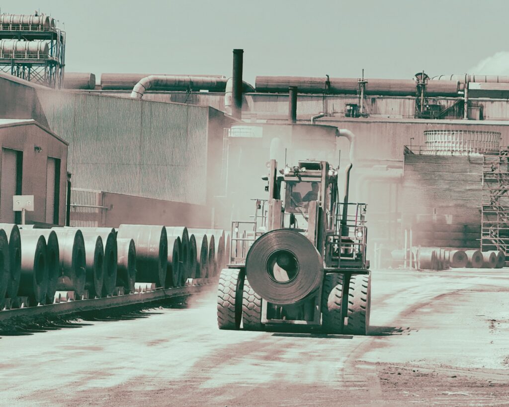 A Taylor forklift working hard a steel mill.